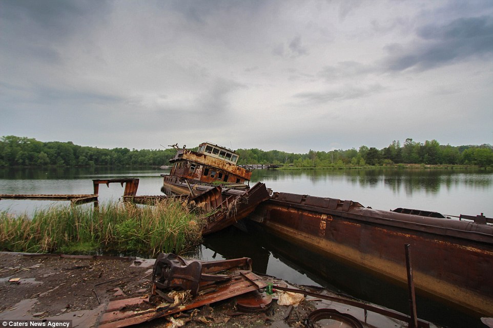 Overcast: An abandoned boat lies in a lake in the town. Russia, Ukraine and Belarus suffered the worst of the contamination from the blast, but increased radiation levels were detected across Europe