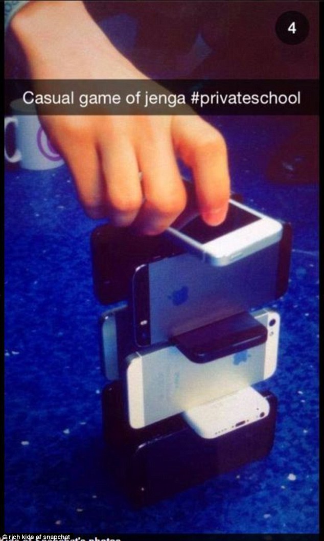 A group of schoolchildren shared this snap playing jenga with their iPhones