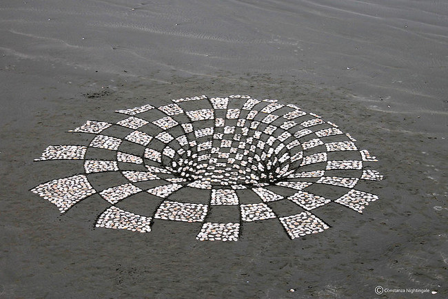 <em>Hole to Another Dimension</em> was created by carefully arranging shells to make the final piece look like an opening.