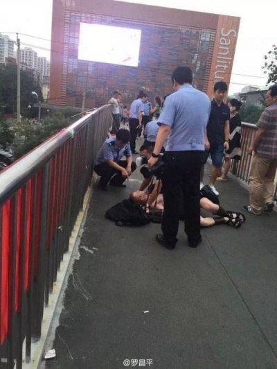 But then things went in a different direction. As the group of men walked along an overpass towards the Sanlitun area, they were overtaken by police and tackled.