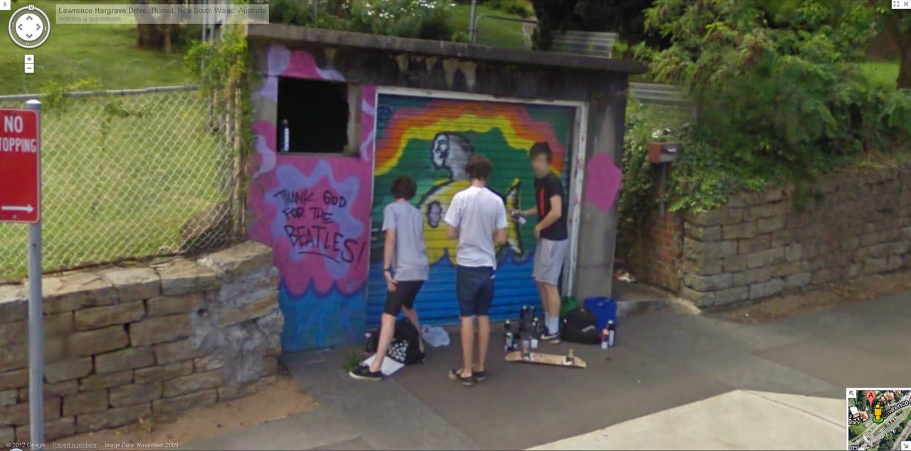 Australian teens caught red-handed while tagging a wall.