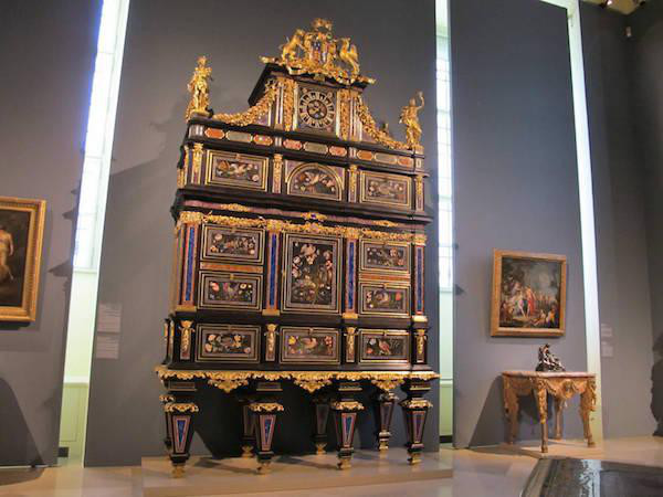 Most Expensive Piece of Furniture: The Badminton Cabinet
Price: $36,662,106

This piece is not actually used for the sport of Badminton in any way, but draws its name from the home of the Dukes of Beaufort, for whom it was made. The Badminton Cabinet was made for Henry Somerset, 3rd Duke of Beaufort, by the Grand Ducal workshops in Florence, from 1720-1732, under the supervision of the Foggini family. The Cabinet incorporates an amazing wealth of materials, from lapis lazuli, agate and Sicilian red and green jasper, to chalcedony and amethyst quartz. It was purchased at a Christie’s auction in 2004 by Dr. Johan Kraeftner, Director of the Liechtenstein Museum in Vienna, on behalf of Prinz Hans-Adam II of Liechtenstein for the same museum.