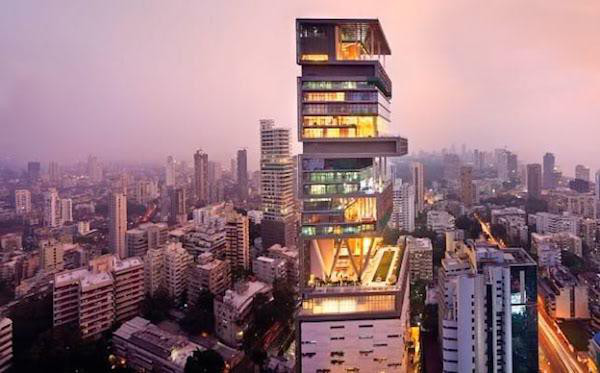 Most Expensive House: Antilia
Price: $500,000,000 - $700,000,000

Though not a home in the traditional sense, Antilia is the name given to the residence of Mukesh Ambani, India’s richest man (at ~$23,000,000,000 net worth), who spent an unspecified amount, projected to conservatively be between $500,000,000 - $700,000,000, constructing this 27-story, 400,000 square-foot monolith in Mumbai, India. Containing, six underground parking floors (with space for 168 cars), three helicopter pads, a spa, terraced gardens, a ballroom, a 50-seat theater, and requiring a 600-person staff to maintain, Antilia is actually claimed to have risen in value to the $1,000,000,000 mark as the result of rising property values in south Mumbai.