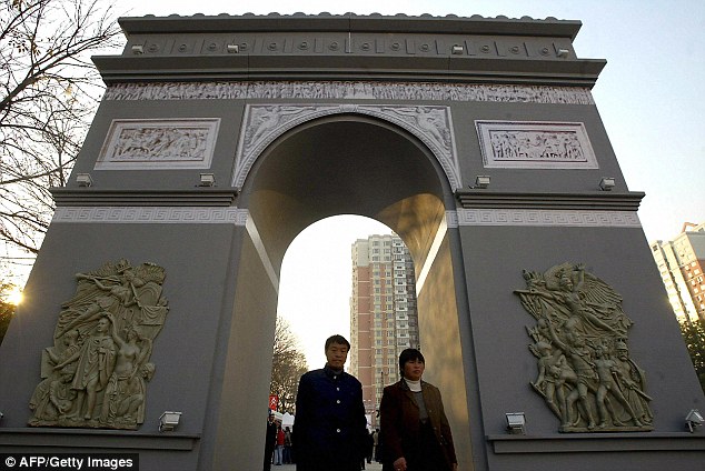French supermarket Carrefour put up an 'Arc de Triomphe', above, outside its Beijing store for publicity