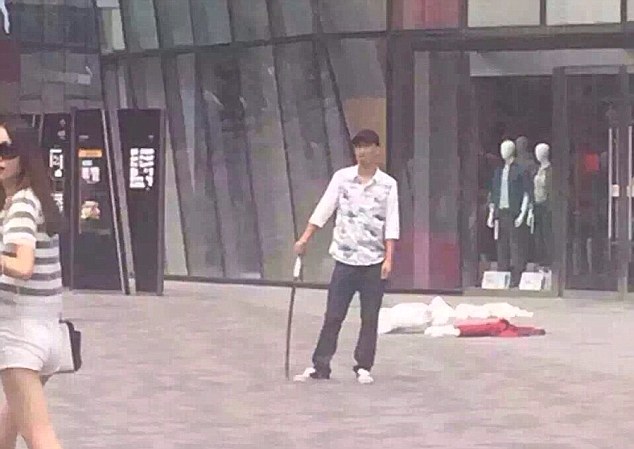 Armed attacker: A man armed with a metre-long sword stabbed a woman to death in Beijing today 