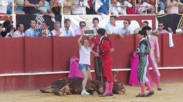 Protest: The animal rights activist jumped into a bullfighting ring to 'give him love before he left this world'