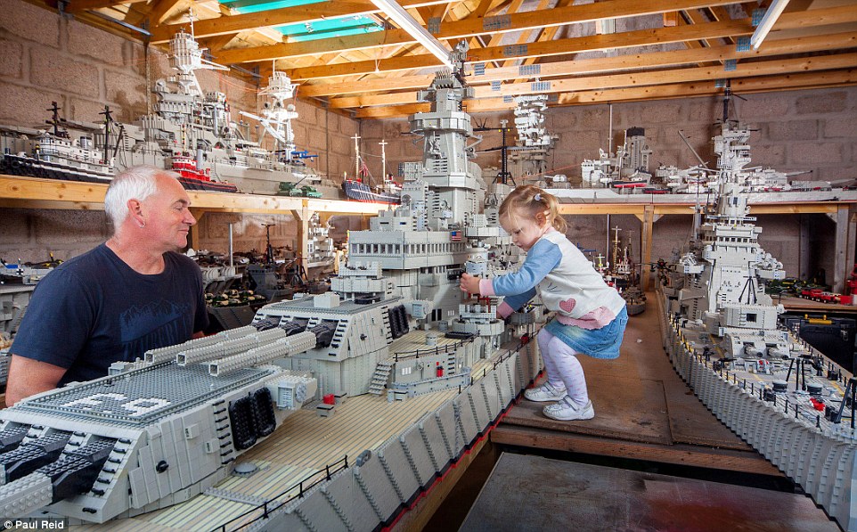 Mr McDonough  and grandaughter Leigha with the USS Missouri (left). Mr McDonough prides himself on not gluing them together - which he regards as 'cheating'