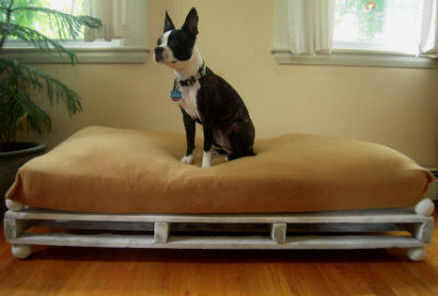 To DIY a cute dog bed, use a crib mattress, a fitted sheet, and a wooden pallet.