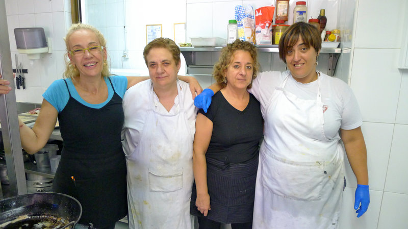 Itziar Eguileor (left), head cook at Restaurante Berrio, poses with the rest of the kitchen staff at their eatery in Galdakao, Spain. The staff used to throw away several pounds of leftover food each night, but now they haul it over to the Solidarity Fridge, Spain's first communal refrigerator, that's designed to cut down on food waste.