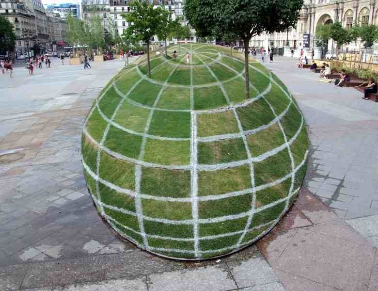Optical illusion created on display outside Paris City Hall. It looks like a giant grass sphere, but it's actually flat.