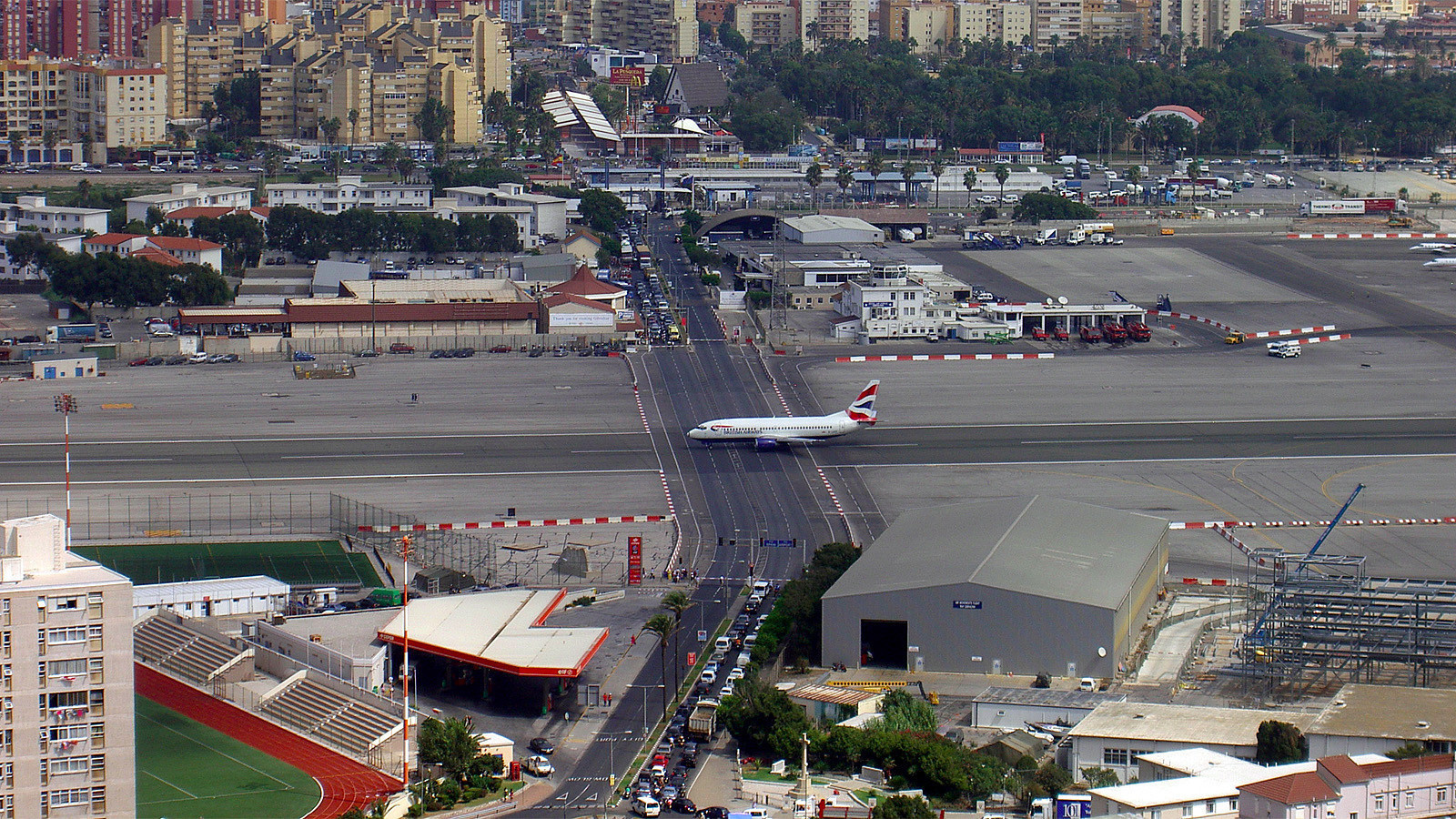 The runway at the Gibraltar International Airport has a regular road crossing through it.