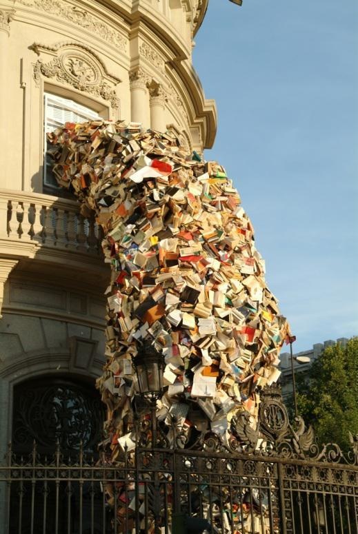 Madrid-based artist Alicia Martin transforms thousands of books into towers that pour out of windows and into the streets.