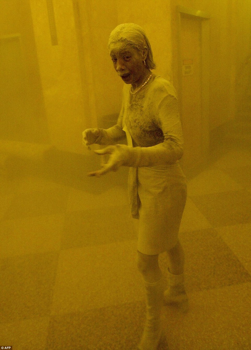 Caked from head to toe in ash  as she stares aghast at the camera, Marcy Borders provided one of the most haunting images of the 9/11 disaster. She was fleeing the World Trade Center in terror when a photographer caught the astonishing shot of her. Ms Borders became known as the ‘Dust Lady’ - and her subsequent tragic fate, sinking into a spiral of depression that led to alcoholism and drug addiction, became a cautionary tale about the impact that the traumatic events of September 11, 2001, had on those who survived. She died last month aged 42 after a year-long battle with stomach cancer, which she and her family blamed on the dust she inhaled during the attack