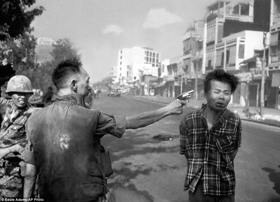 South Vietnamese police chief Nguyen Ngoc Loan executes a handcuffed Viet Cong officer with a single pistol shot to the head in Saigon in 1968 during the Tet Offensive. The photo, by Eddie Adams, became one of the Vietnam War's most indelible images and would earn him a Pulitzer Prize. The image was broadcast around the world - and such was its political impact, it soured Americans' attitude towards the war by highlighting its savage reality