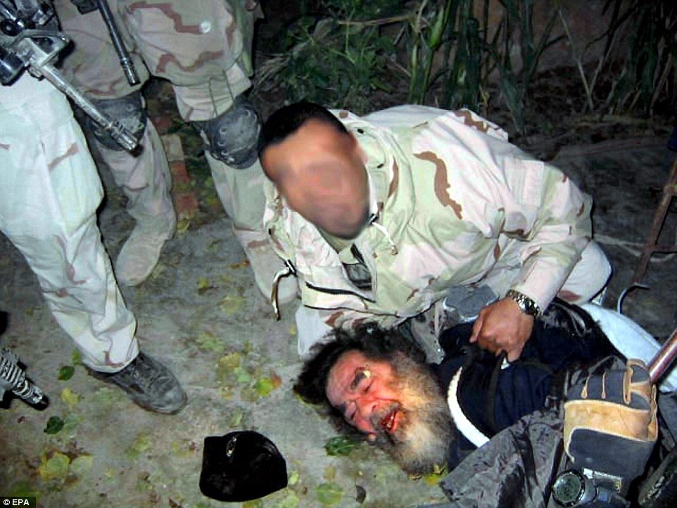 Time ran out for deposed Iraqi dictator Saddam Hussein on December 13, 2003, as US forces stormed his hiding place - a hole about 8ft deep at a remote farmhouse near Tikrit in an operation entitled Operation Red Dawn. Looking dishevelled, Saddam offered no resistance as he was captured and taken to a secure area. News of his arrest was greeted with relief and delight around the world. Afterwards Paul Bremer, head of the Coalition Provisional Authority in Iraq, told a news conference: 'Ladies and gentlemen - we got him!' But rather than ushering in a new era of peace and democracy in the region, as the Bush administration had hoped, civil war among Sunni and Shia would ensue, ultimately leading to the rise of ISIS