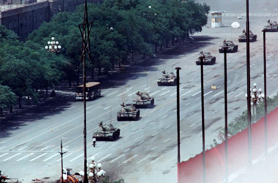 A Peking citizen stands in front of tanks during the crushing of the Tiananmen Square uprising in June 1989. China allows no public discussion of the massacre, when soldiers backed by tanks and armoured personnel carriers fought their way into the heart of Beijing (then known as Peking), killing hundreds of unarmed pro-democracy protesters and onlookers. In one of the greatest challenges to the communist state, the protesters - mainly students - had occupied the square for seven weeks, and had refused to leave until their voices were heard. Last year marked the 25th anniversary of the bloody suppression - but there was heavy security to stop any attempts to publicly commemorate one of the darkest chapters in the country's history. Despite China's discouragement, the crackdown is recalled with rallies and commemorations in Chinese communities worldwide, especially in Hong Kong
