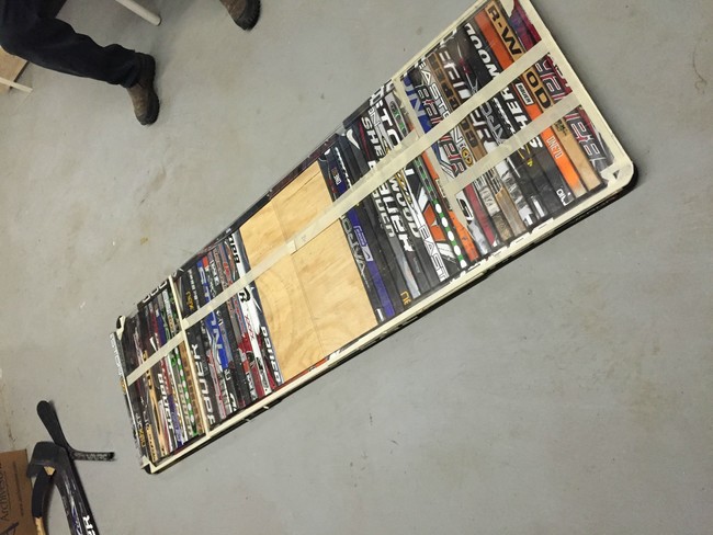 The frame was created using more hockey sticks, and a plexiglass sheet was added to create an even base.