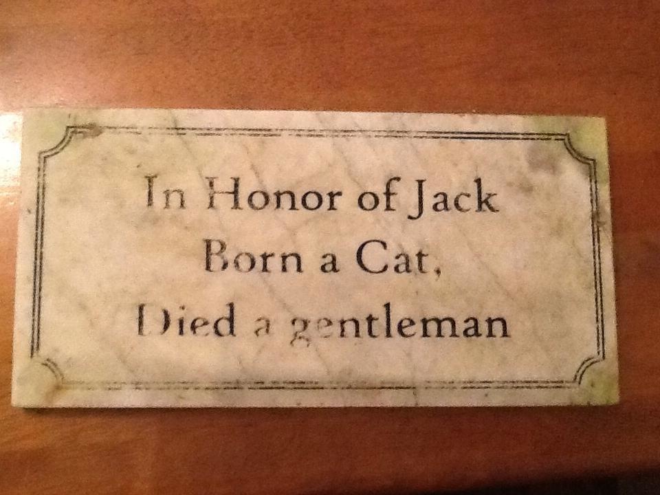 The plaque of a beloved cat.