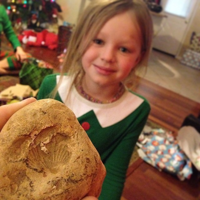 A little girl found a fossilized rock in her backyard. Appropriately, she gave it to her mom for Christmas. 