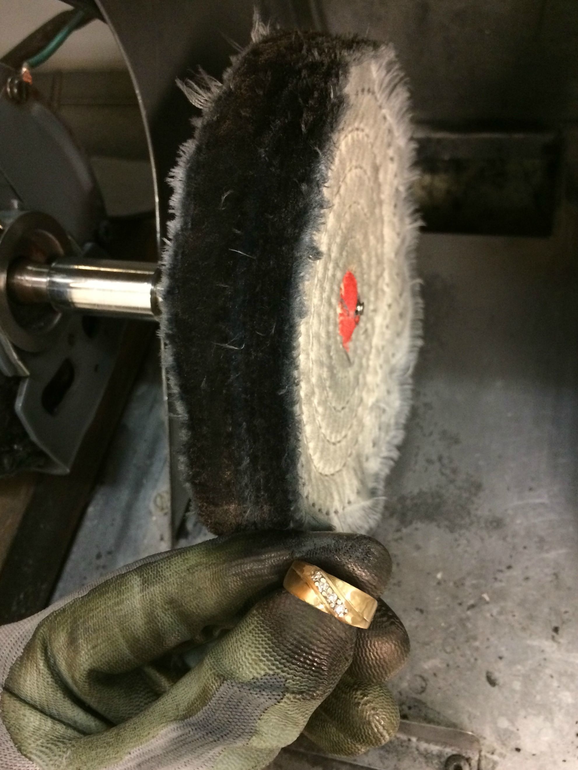 Then, the buffing wheel returns the ring to its former glory.