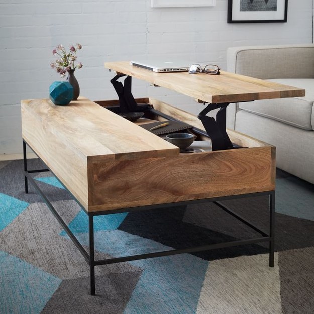 A coffee table that can rise up to lap level.