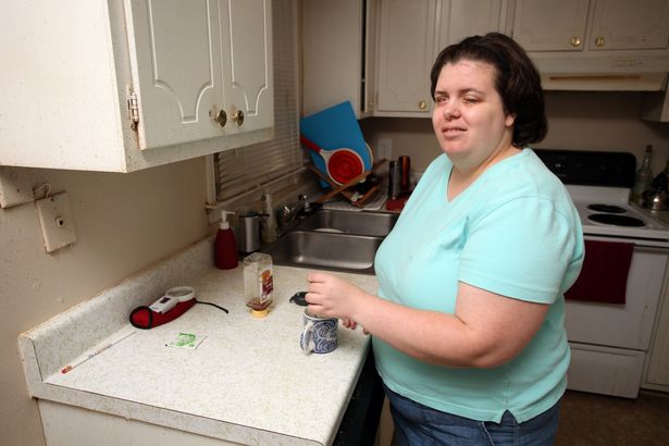 Jewel Shuping making a cup of tea at home on August 12, 2015 in Raleigh, North Carolina.
