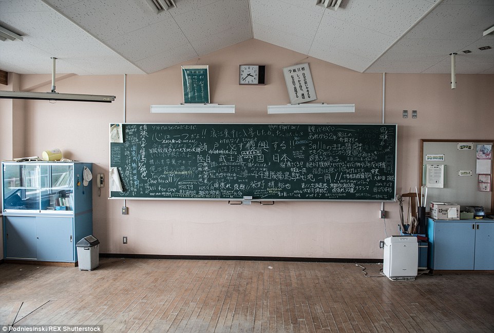 A classroom blackboard still displays the scribbles of what children were learning the moment the earthquake struck