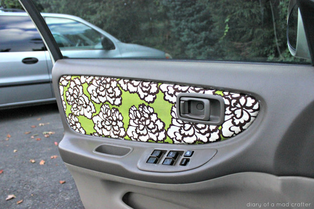 Reupholster your car door with a fabric of your choice.