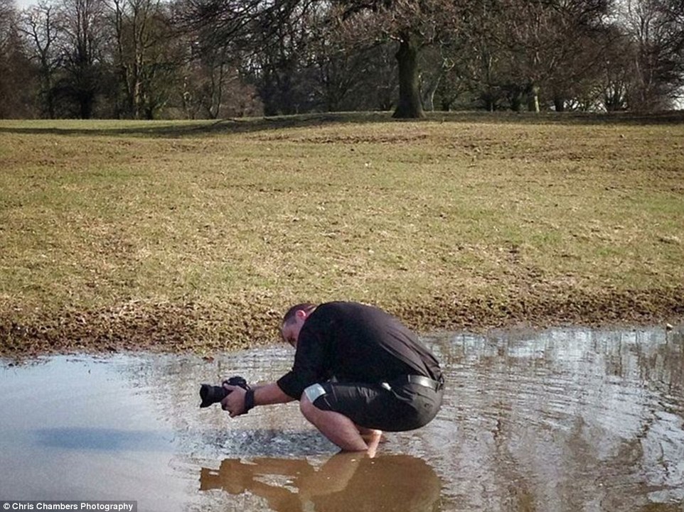 Chris ankle-deep in muddy water to create the perfect shot 