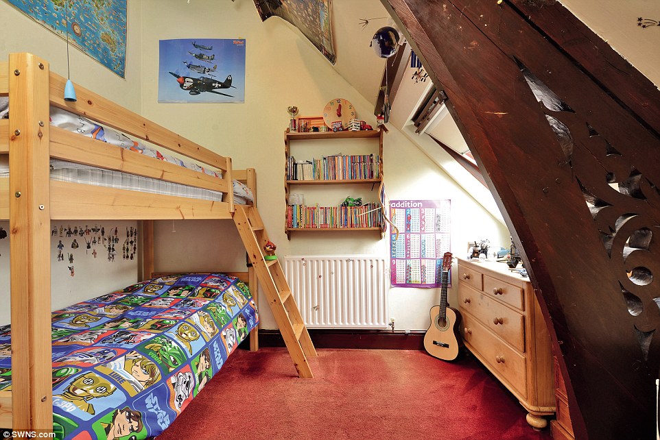 Bunk beds: One of the three bedrooms forming part of the unusual property, which is a Gothic church with its own graveyard