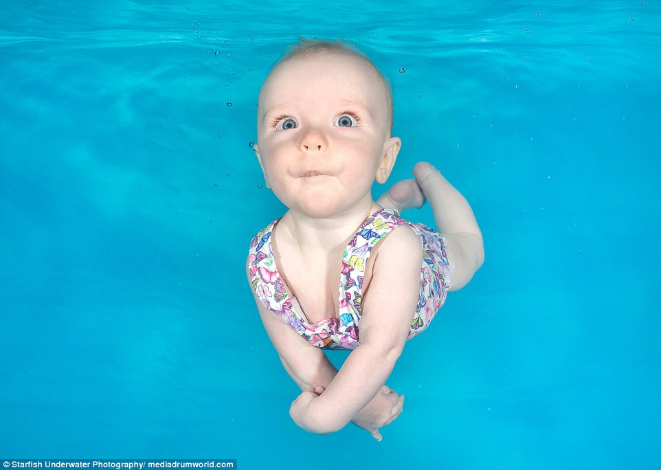 Sophia, four months old, at an underwater photoshoot at Hydro at the Barn in Lancashire, pulls her best pose as she opens her eyes in an underwater world 