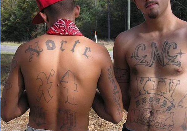 Norteño 

Norteño tattoos represent the Nuestra Familia gang, which is associated with Hispanic gangs in Northern California. Their tattoos include the word Norteño, Nuestra Familia, a sombrero symbol, the letter N or the number 14, symbolizing the 14th letter of the alphabet (yup – the letter N).