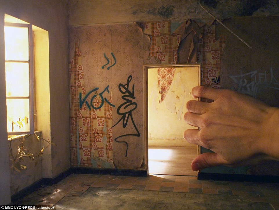 Another film set by artist Laurie Courbier shows a miniature run-down room, featuring peeling wallpaper, old tile-work and graffiti on the walls