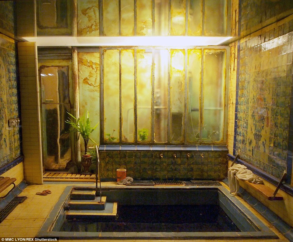 Les Bains D'Asniers: A scene by Ronan Jim Sevellec features an old pool, with belongings strewn around the room