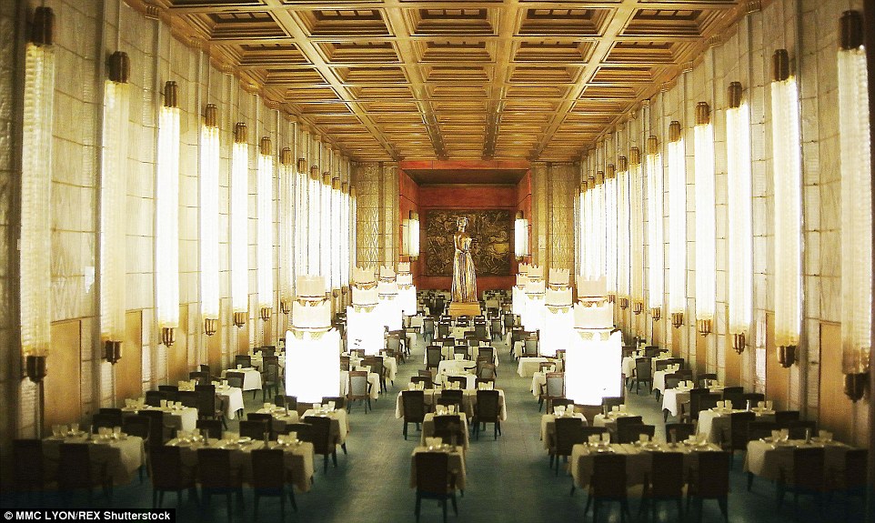 Le Normandie, by Ohlmann created at 1:12 scale of the real room. The life-like scene includes cups and crockery on the tables, with large lights illuminating the scene