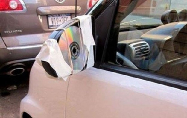 Broken side mirror? Just replace the glass with an equally reflective CD.