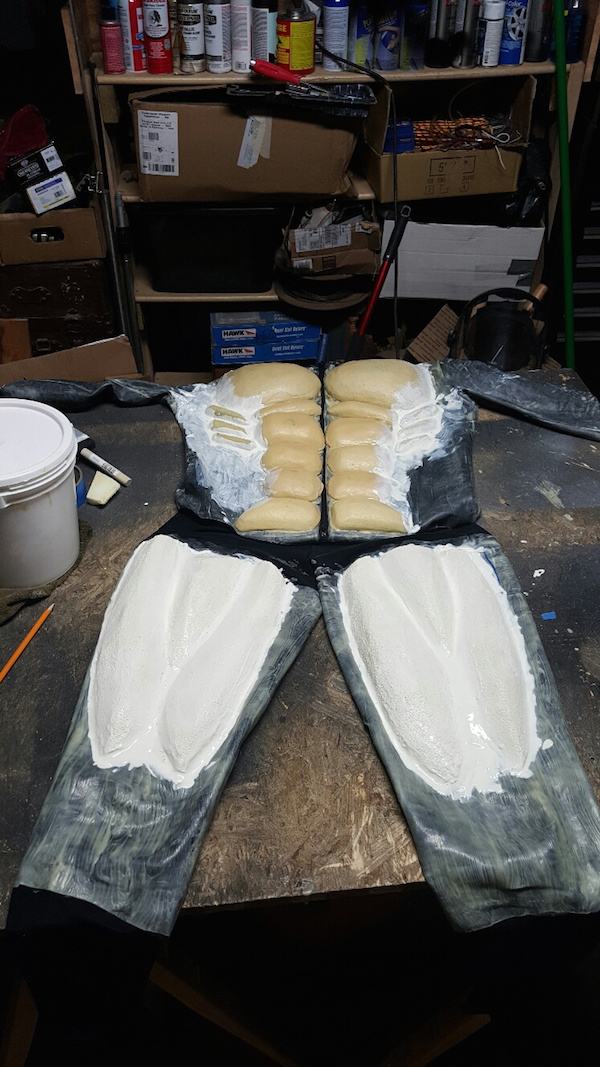 "Using a spandex onesie each piece of foam was glued on then covered with multiple coats of latex."