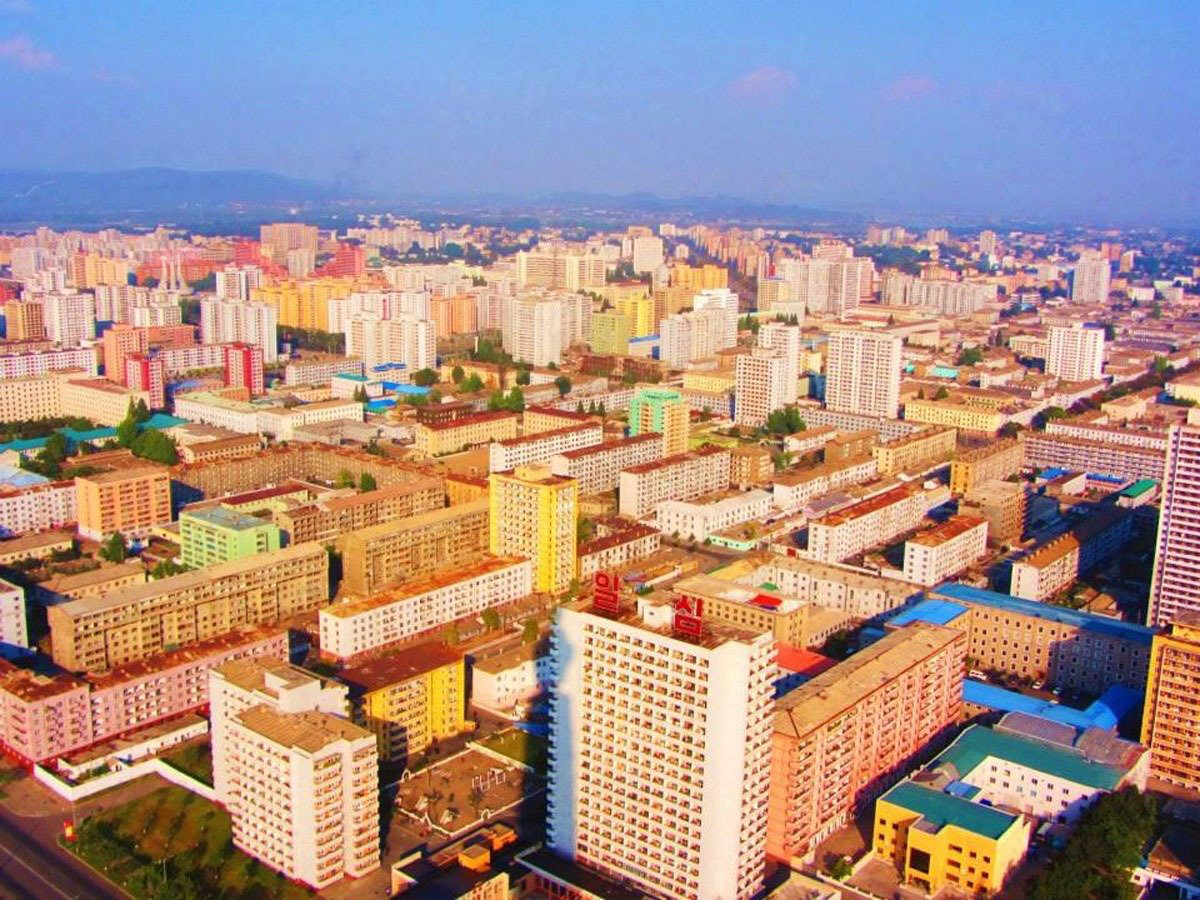 This shot of the capital, Pyongyang, was taken in-flight. When they landed, their phones were searched for GPS capability and their passports were actually taken away until their departure. 

Anna said, "The scariest part of the trip was knowing that no matter what, it was simply impossible at that point to get out of the country, even if we wanted to."