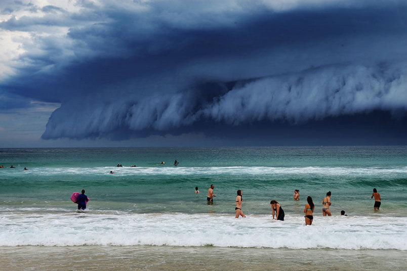A shelf cloud replaced the blue sky, and horrified and excited onlookers alike made sure to document it.