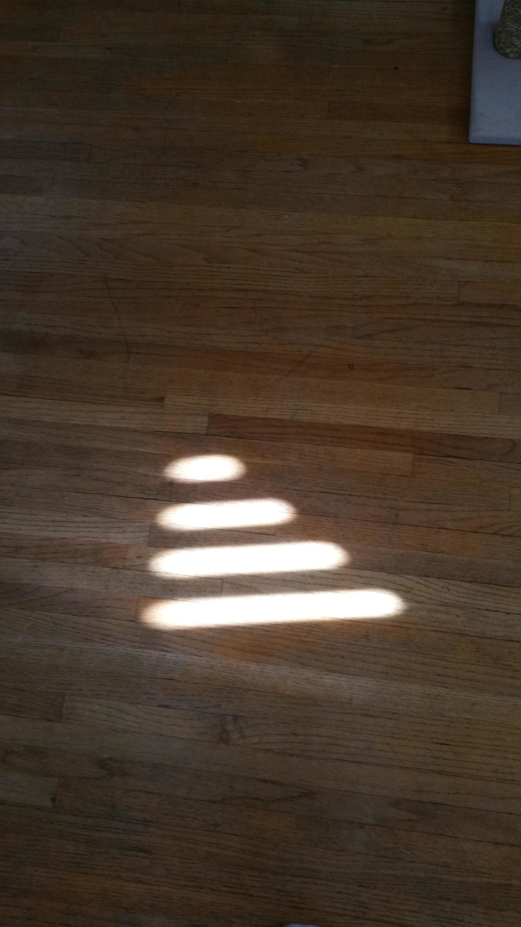 The sun coming through the window looks like a giant wifi signal.