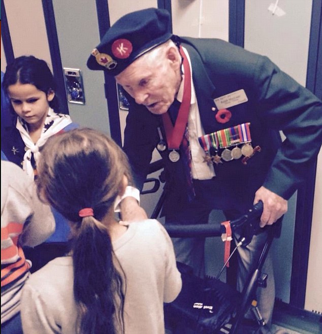 Ralph MacLean, from Canada, who served during the Second World War in Hong Kong and was captured on Christmas Day 1941, met with the student during a visit to St Patrick's Community School in Alberta, where he gave a talk about his wartime experiences 