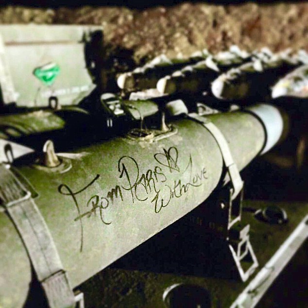 Revenge: The photographs appear to show the message scrawled over the Hellfire missiles and JDAM bombs, in an act of solidarity for those affected in the Paris attacks