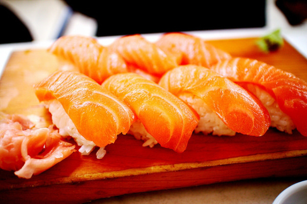 Sushi
Sushi is one of the more commonly consumed foods that can contain raw seafood or meat. Just make sure the sushi you eat is prepared correctly. 

Source
