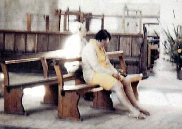 In 1975, Diane and Peter Berthelot visited the Worstead Church in Norfolk, UK. While at the church, Peter took a photo of his wife sitting and praying on one of the church benches. Whenever they developed the film, there was a bizarre ghostly figure sitting behind Diane. When they went back to the church, a local vicar told them it was the White lady, the ghost of a healer who was believed to haunt the church.