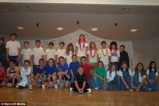 Towering over her peers: Chase (back row, center) is pictured during her fifth grade school talent show 