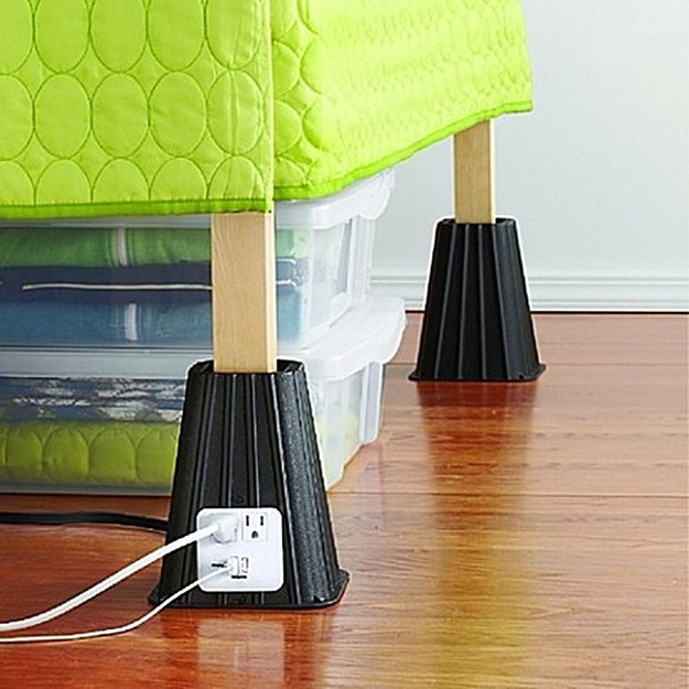 Bed risers with built-in electrical outlets.