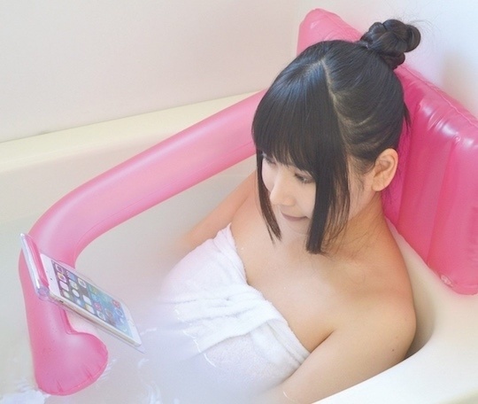 An inflatable bath pillow that can hold your smartphone. 