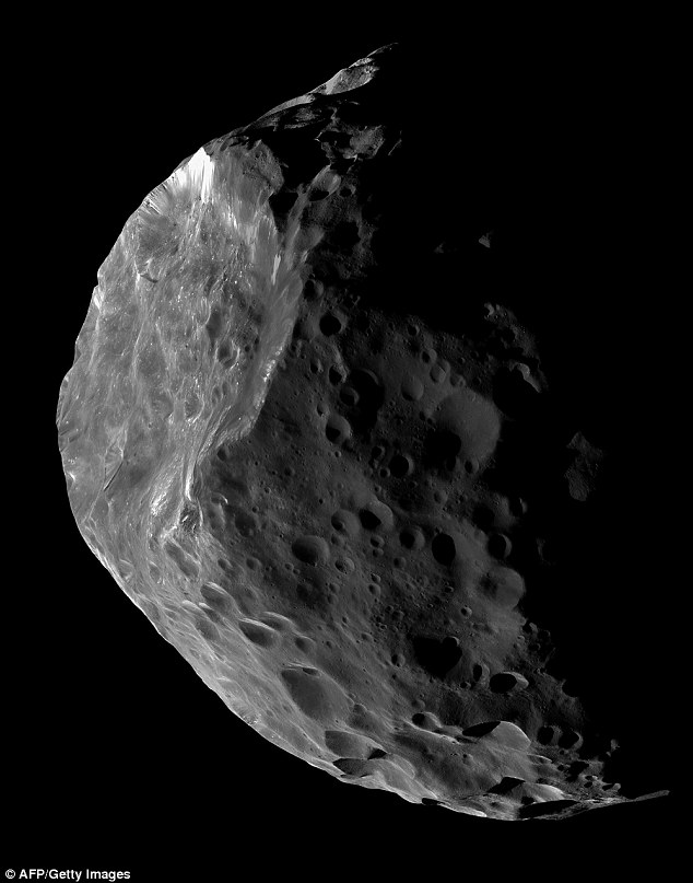Saturn's moon Phoebe (pictured) is likely to be a giant comet or a centaur that was captured by that planet's gravity at some time in the past