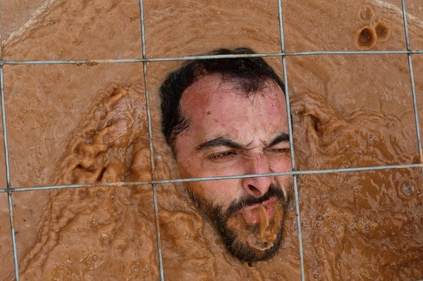 All sorts of questions arise from this photo. Is that mud or... 