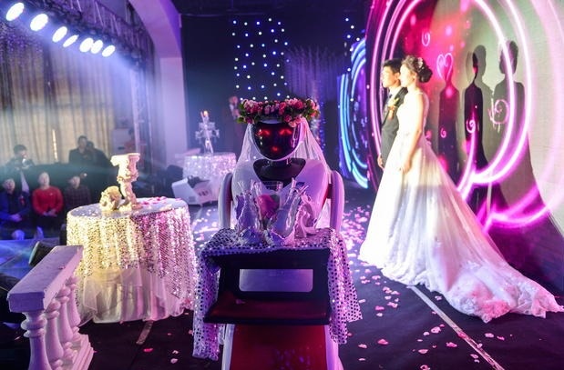 Is a robot trying to steal the bride's spotlight?